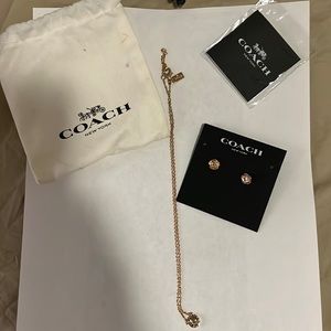 Coach necklace/earring set with cloth bag and jewelry care booklet